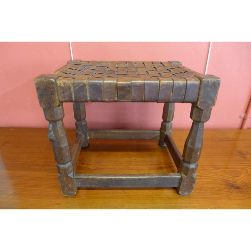 146 - A Robert Mouseman Thompson carved oak and brown leather stool