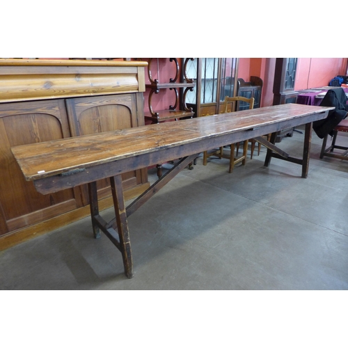 149 - A Victorian pine trestle table, 75cms h, 305cms w, 53cms d