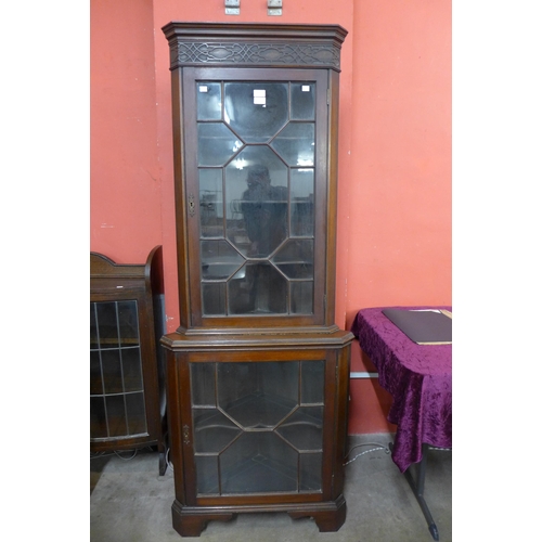 150 - An Edward VII Chippendale Revival mahogany freestanding corner cabinet