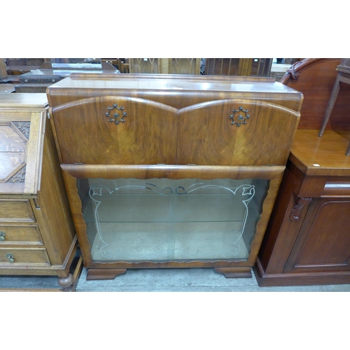 159 - An Art Deco walnut cocktail cabinet