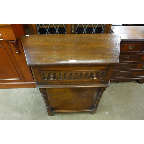 161 - A Bevan Funnel carved oak single drawer side table