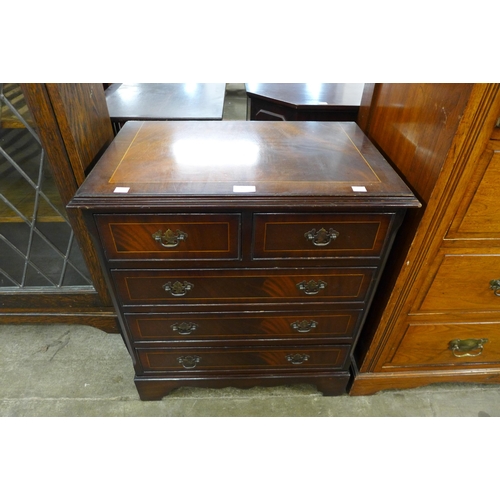 163 - A small inlaid mahogany chest of drawers