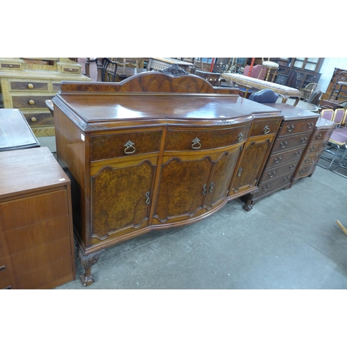 166 - An early 20th Century burr walnut bow front sideboard