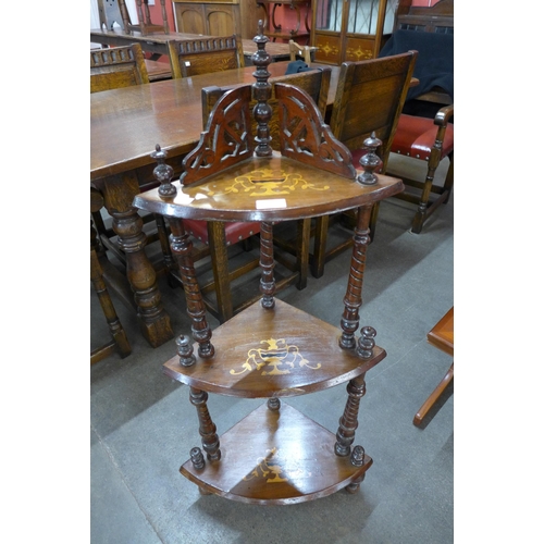 172 - A Victorian marquetry inlaid walnut three tier corner whatnot