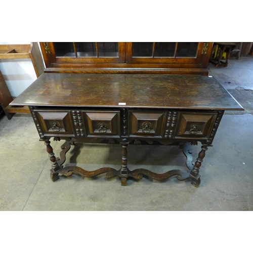 189 - A 17th Century style oak geometric moulded two drawer dresser base