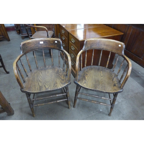 190 - A pair of Victorian elm and oak desk chairs