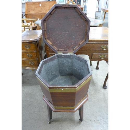 203 - A George III mahogany and brass banded octagonal wine cooler