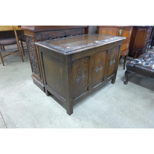 204 - A carved oak blanket box