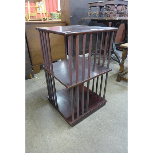 209 - A small mahogany revolving bookcase