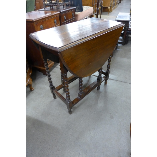 215 - An oak barleytwist gateleg table