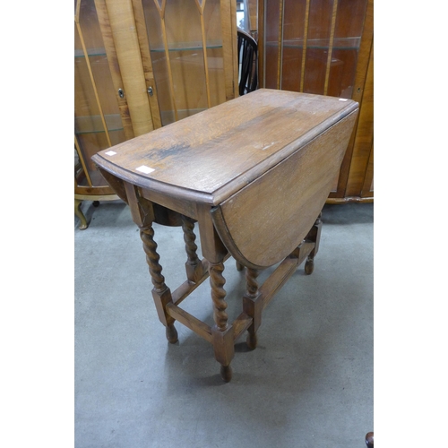 216 - An oak barleytwist gateleg table