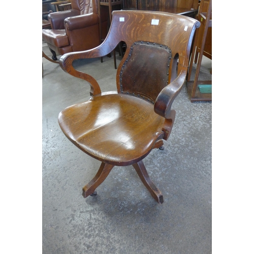 225 - A Victorian oak revolving Captain's desk chair