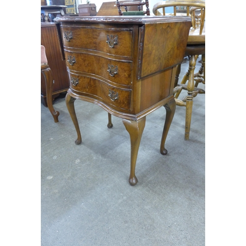 239 - A burr walnut serpentine chest of drawers