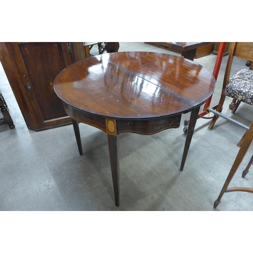 246 - A George III inlaid mahogany demi-lune fold over tea table