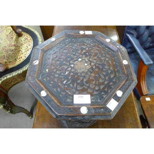 250 - A Moorish carved hardwood and mother of pearl inlaid octagonal occasional table a/f