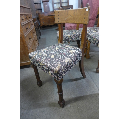 260 - A set of four Victorian Gothic Revival oak dining chairs