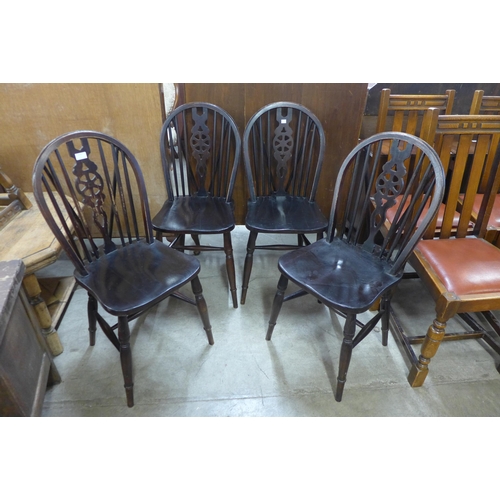 273 - A set of four beech wheelback kitchen chairs