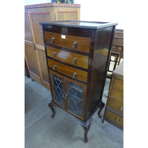 284 - An Edward VII mahogany bow front music cabinet