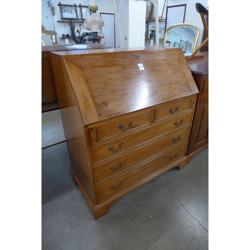 289 - A hardwood bureau and a tallboy