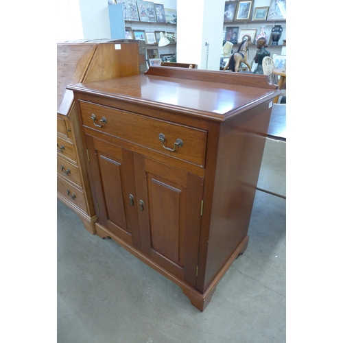 289 - A hardwood bureau and a tallboy