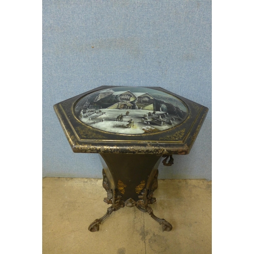 322 - A Victorian wrought steel and gilt inlaid purdonium, with winter church scene painted glass top