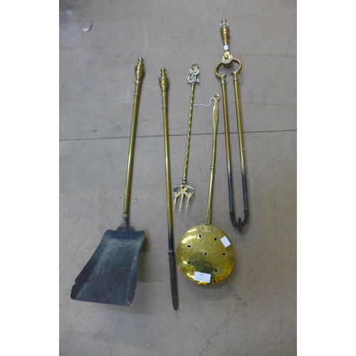 329 - A brass companion set and a chestnut roaster