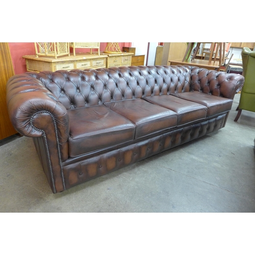 59 - A chestnut brown leather Chesterfield settee, 73cms h, 248cms w, 88cms d