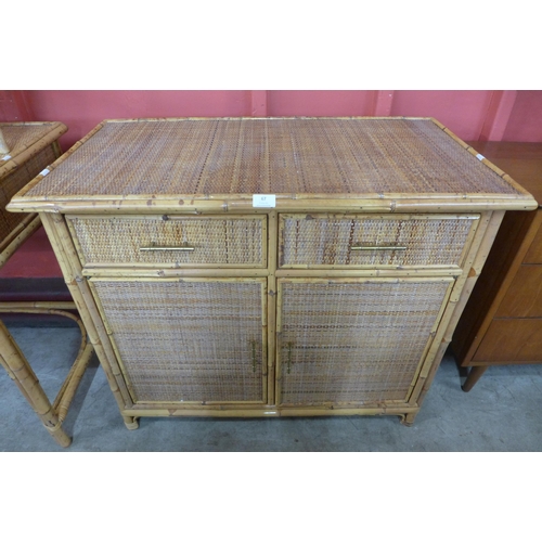 67 - A bamboo and rattan two door, two drawer sideboard