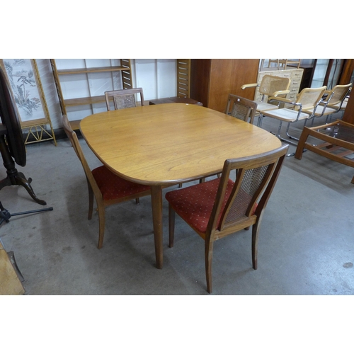 70 - A G-Plan teak extending dining table and four chairs