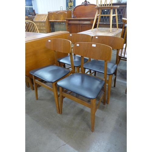 81 - A set of four teak dining chairs