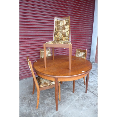 81A - A G-Plan Fresco teak extending dining table and four chairs, a/f