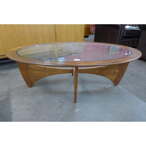 83 - A G-Plan Astro teak and glass topped oval coffee table