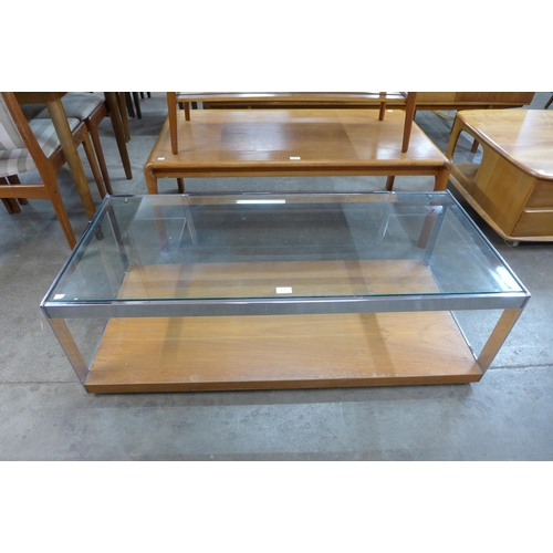 91 - A Merrow Associates chrome and glass topped coffee table, designed by Richard Young