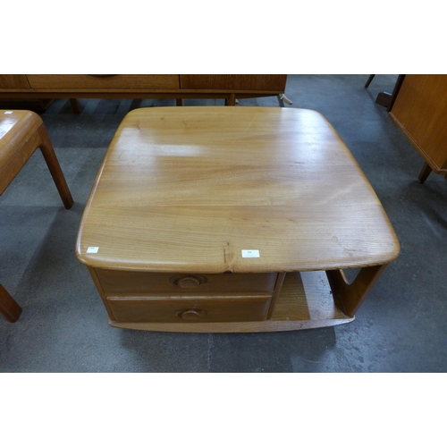 94 - An Ercol Blonde elm Pandora's Box coffee table