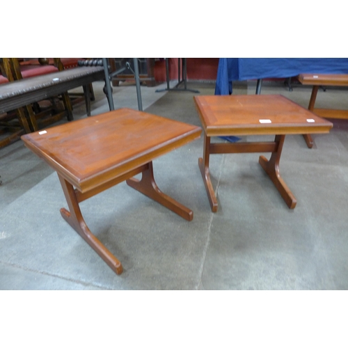 95 - A pair of teak occasional tables