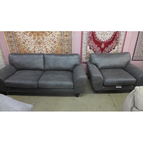 1531 - A charcoal upholstered three seater sofa and a love seat