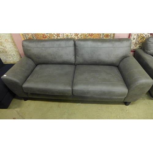 1531 - A charcoal upholstered three seater sofa and a love seat