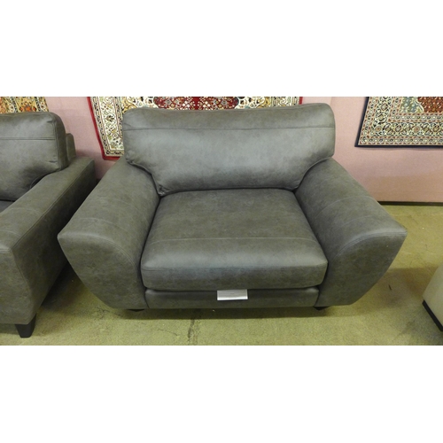 1531 - A charcoal upholstered three seater sofa and a love seat