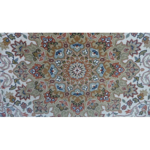 1532 - A cream ground full pile Wilton carpet with floral pattern, 300cm x 200cm