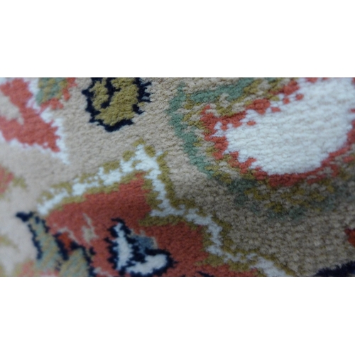 1532 - A cream ground full pile Wilton carpet with floral pattern, 300cm x 200cm