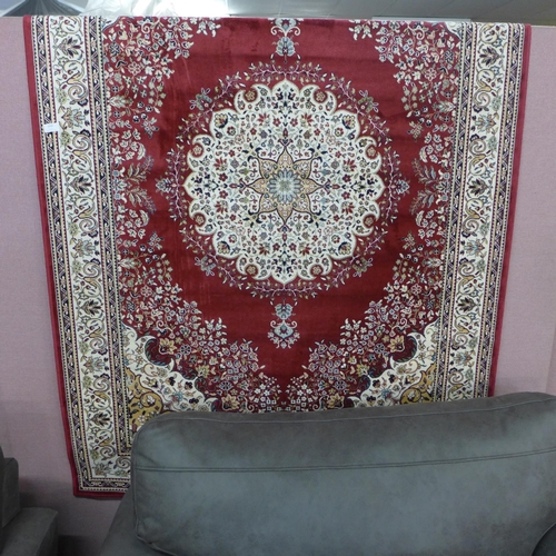 1533 - A red ground Royal Palace rug with Persian pattern, 170cm x 120cm