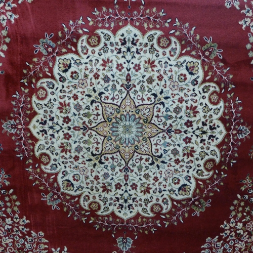 1533 - A red ground Royal Palace rug with Persian pattern, 170cm x 120cm