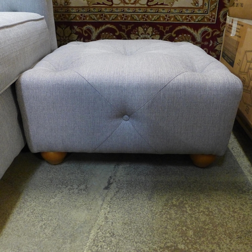 1542 - A grey upholstered Chesterfield three seater, two seater and a footstool