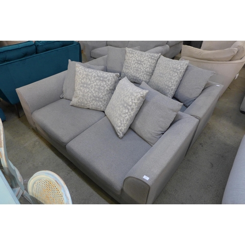 1543 - A pair of grey textured weave upholstered, scatter back three seater sofas