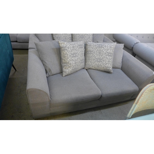 1543 - A pair of grey textured weave upholstered, scatter back three seater sofas