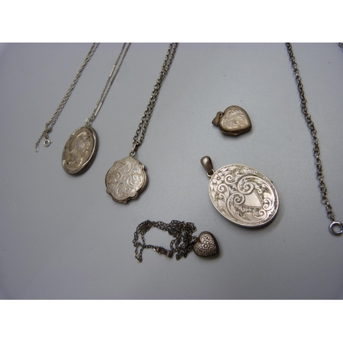 1000 - Five silver and white metal lockets and chains