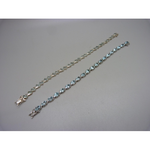 1006 - Two silver and topaz tennis bracelets