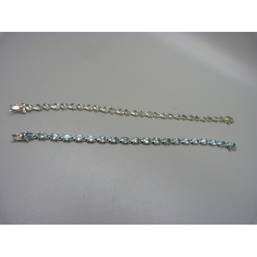 1006 - Two silver and topaz tennis bracelets