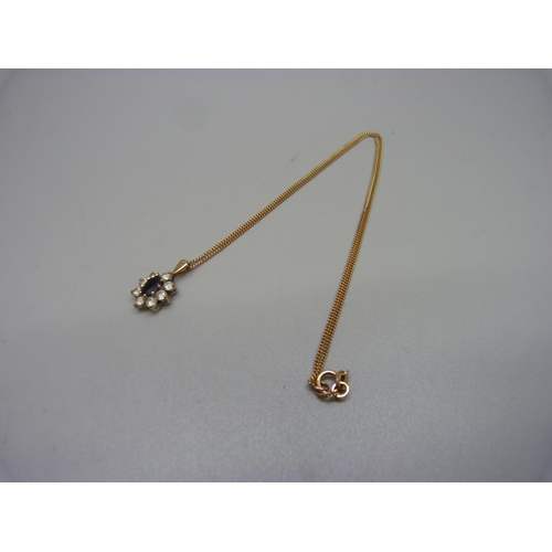 1009 - A 9ct gold, sapphire and white stone pendant and chain, 3.4g