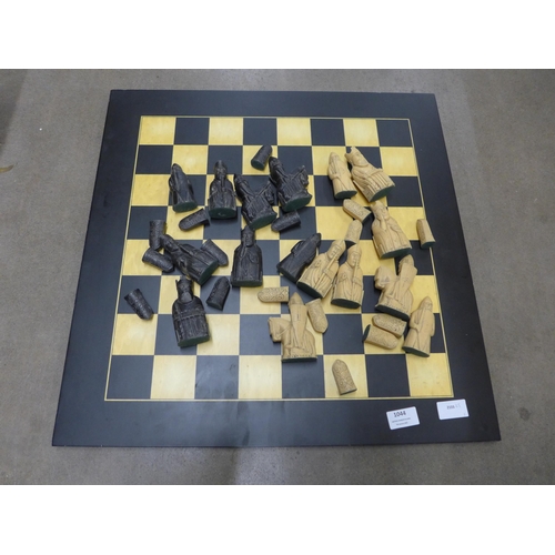 1044 - A chess board and pieces **PLEASE NOTE THIS LOT IS NOT ELIGIBLE FOR POSTING AND PACKING**